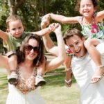 Parents with children sitting on the shoulders